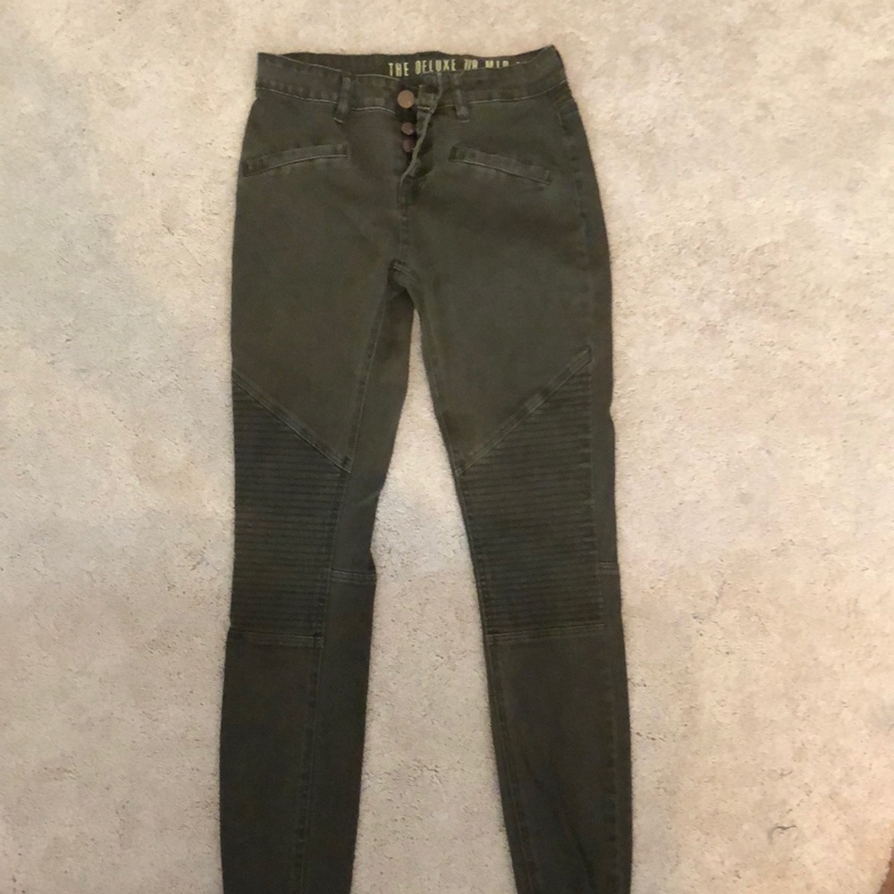 Olive green mid rise jeans.